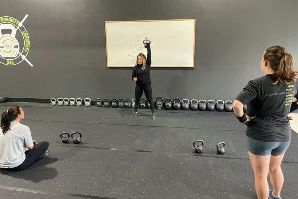 womans with kettlebell